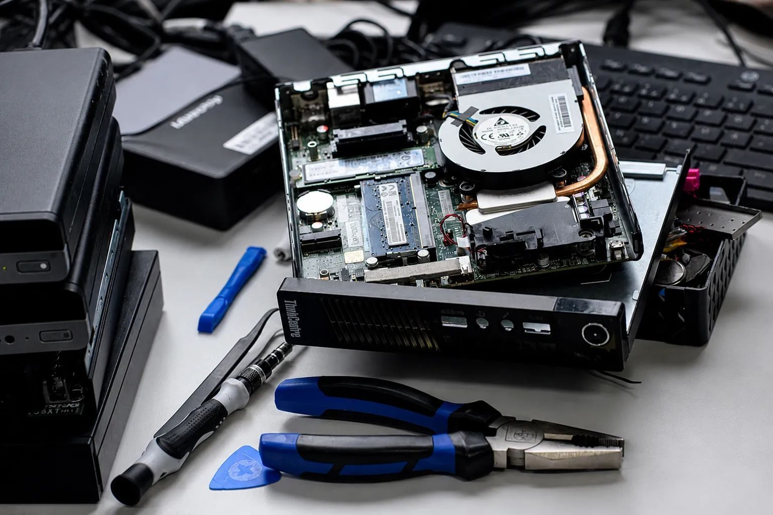 A mini PC opened up on the bench for testing